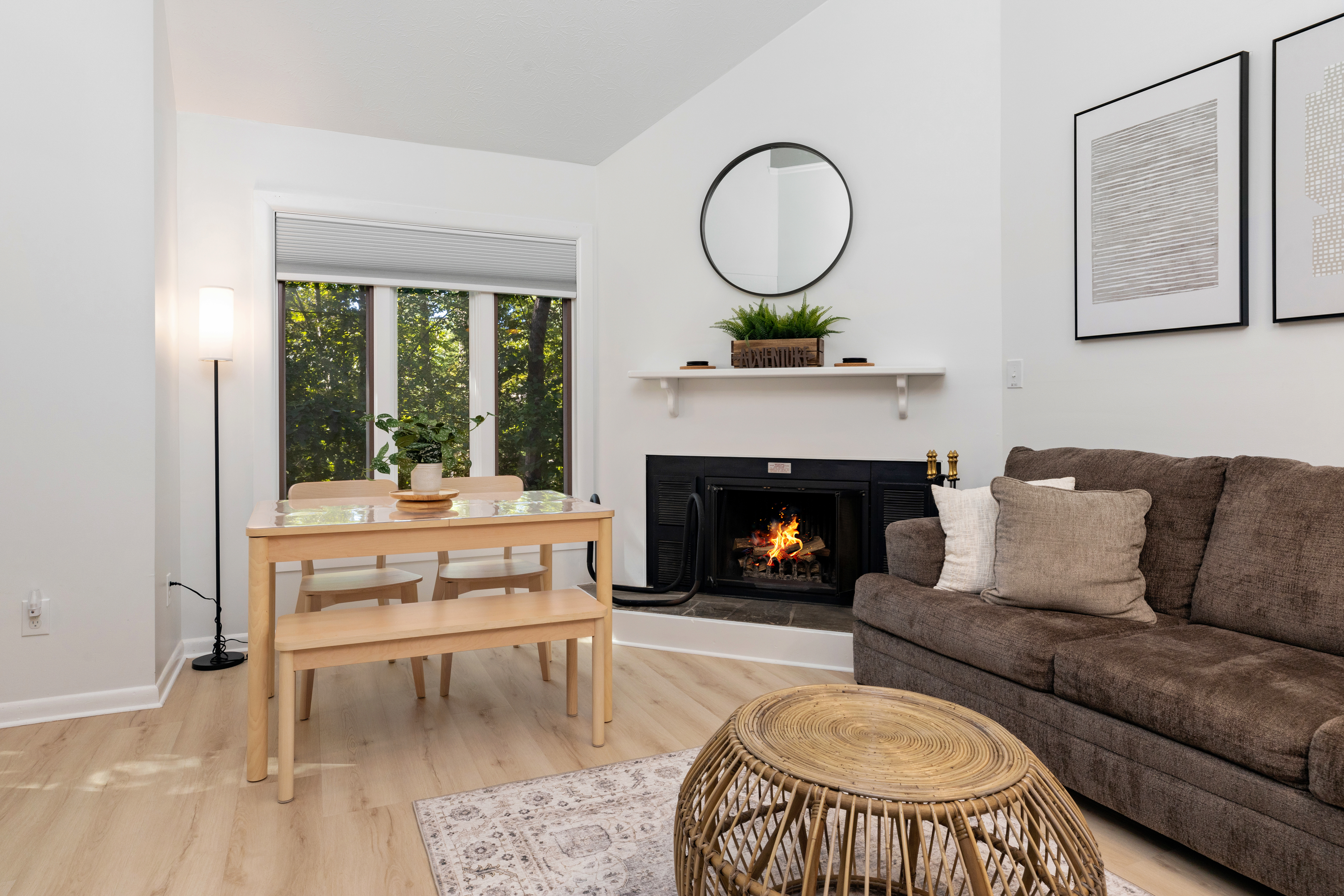 Living room with fireplace and dining table at The Retreat at Three Ridges, Wintergreen VA