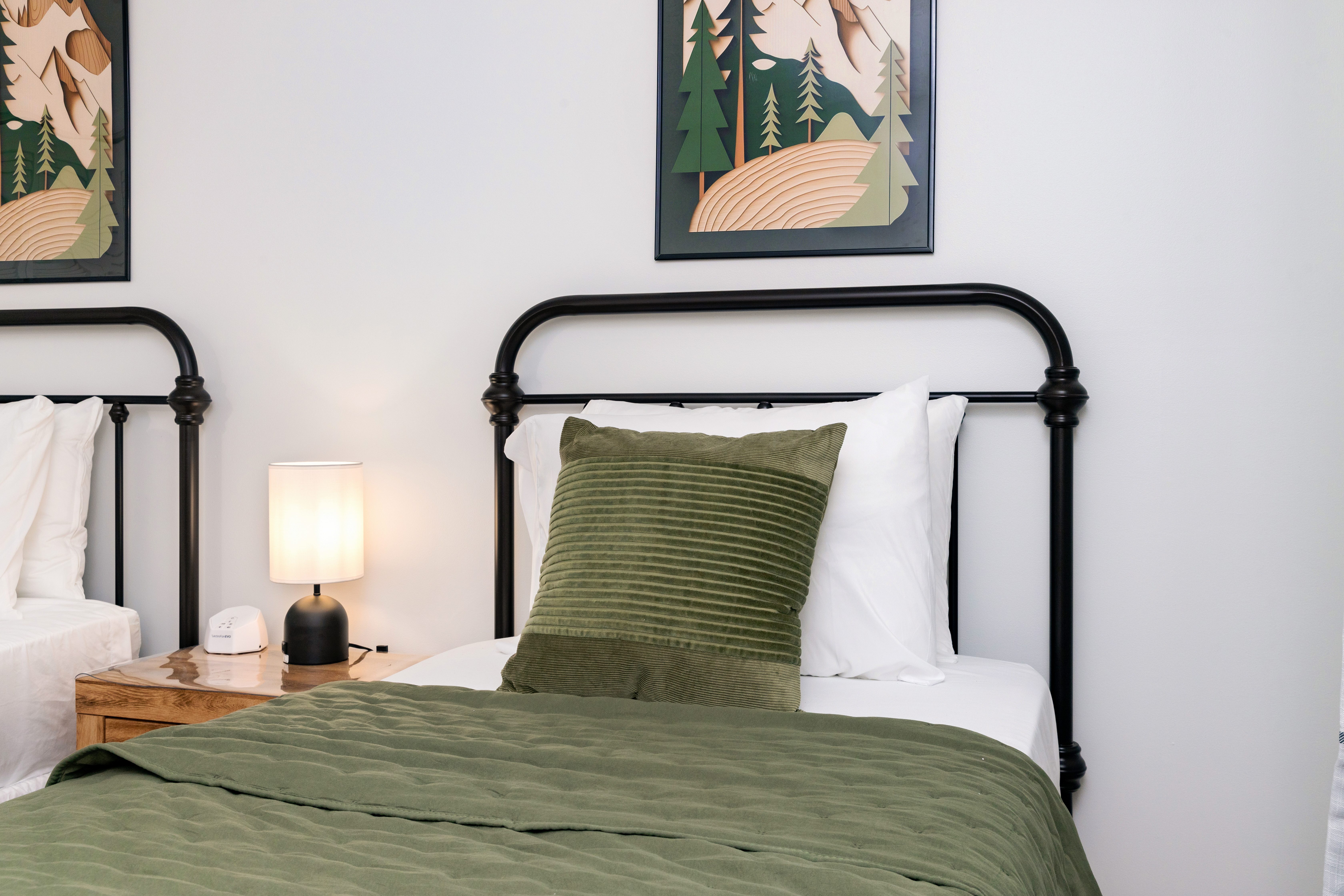 Twin bed detail and nightstand at The Retreat at Three Ridges, Wintergreen VA