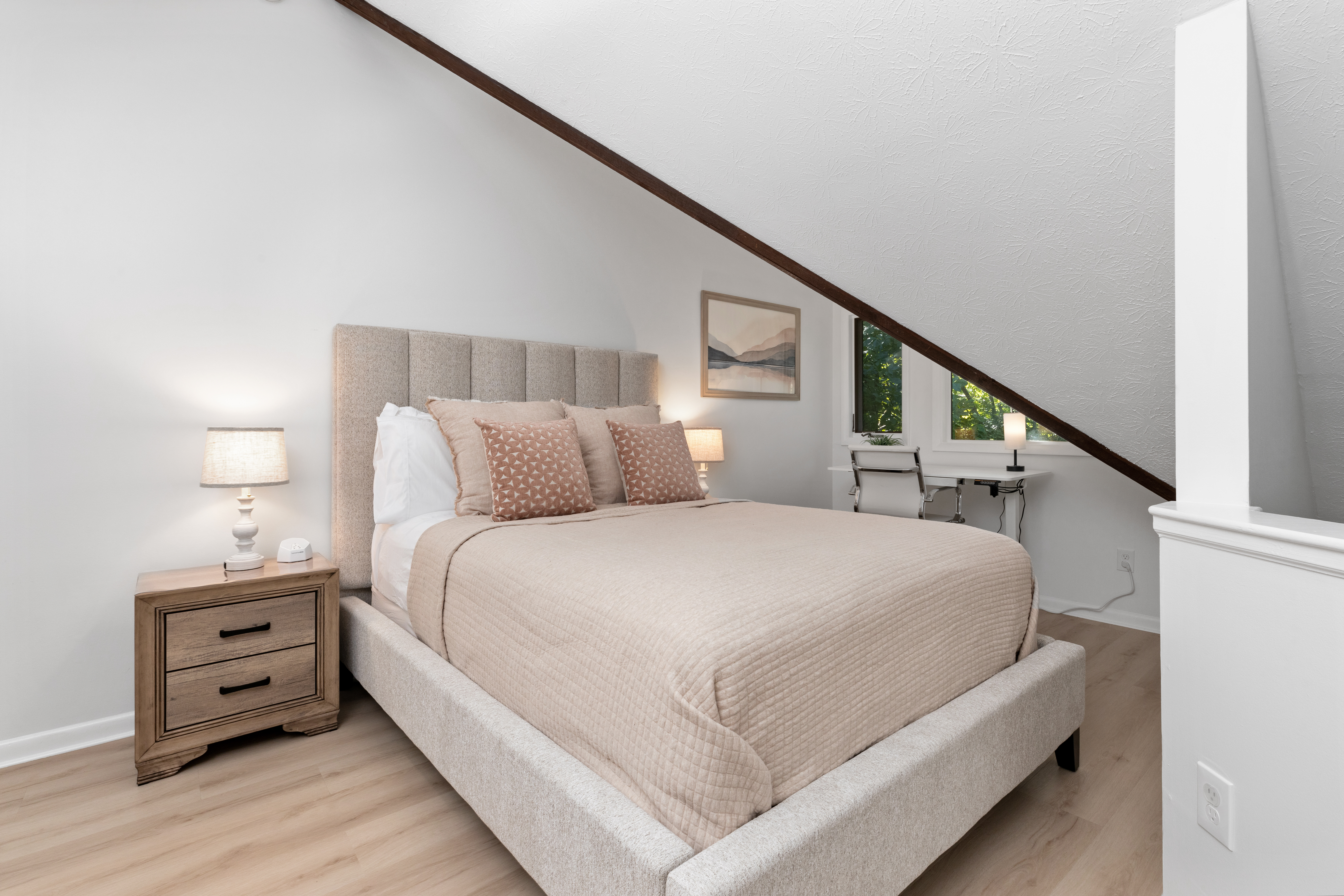 Primary bedroom with queen bed and desk at The Retreat at Three Ridges, Wintergreen VA