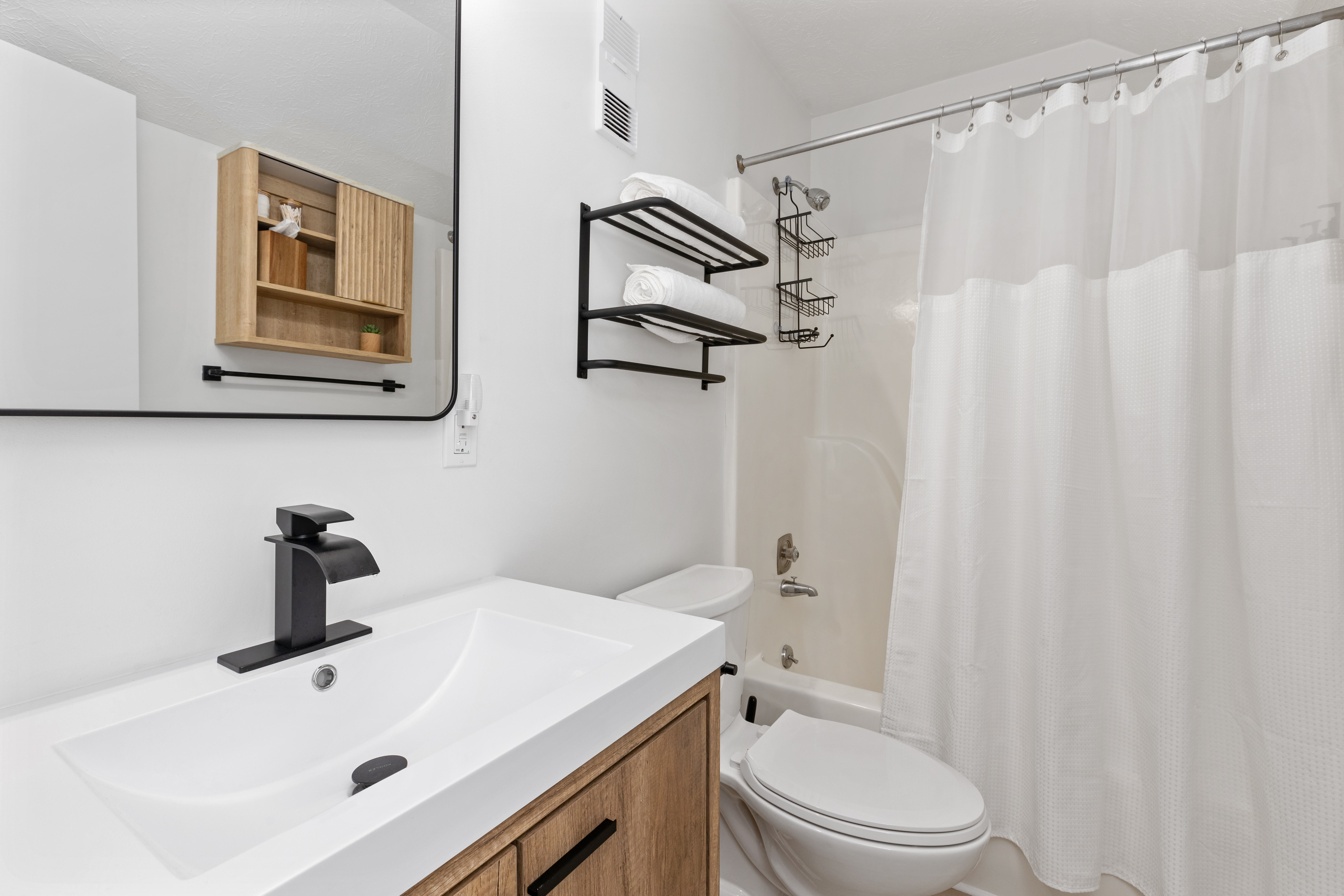 Bathroom full view with shower and vanity at The Retreat at Three Ridges, Wintergreen VA