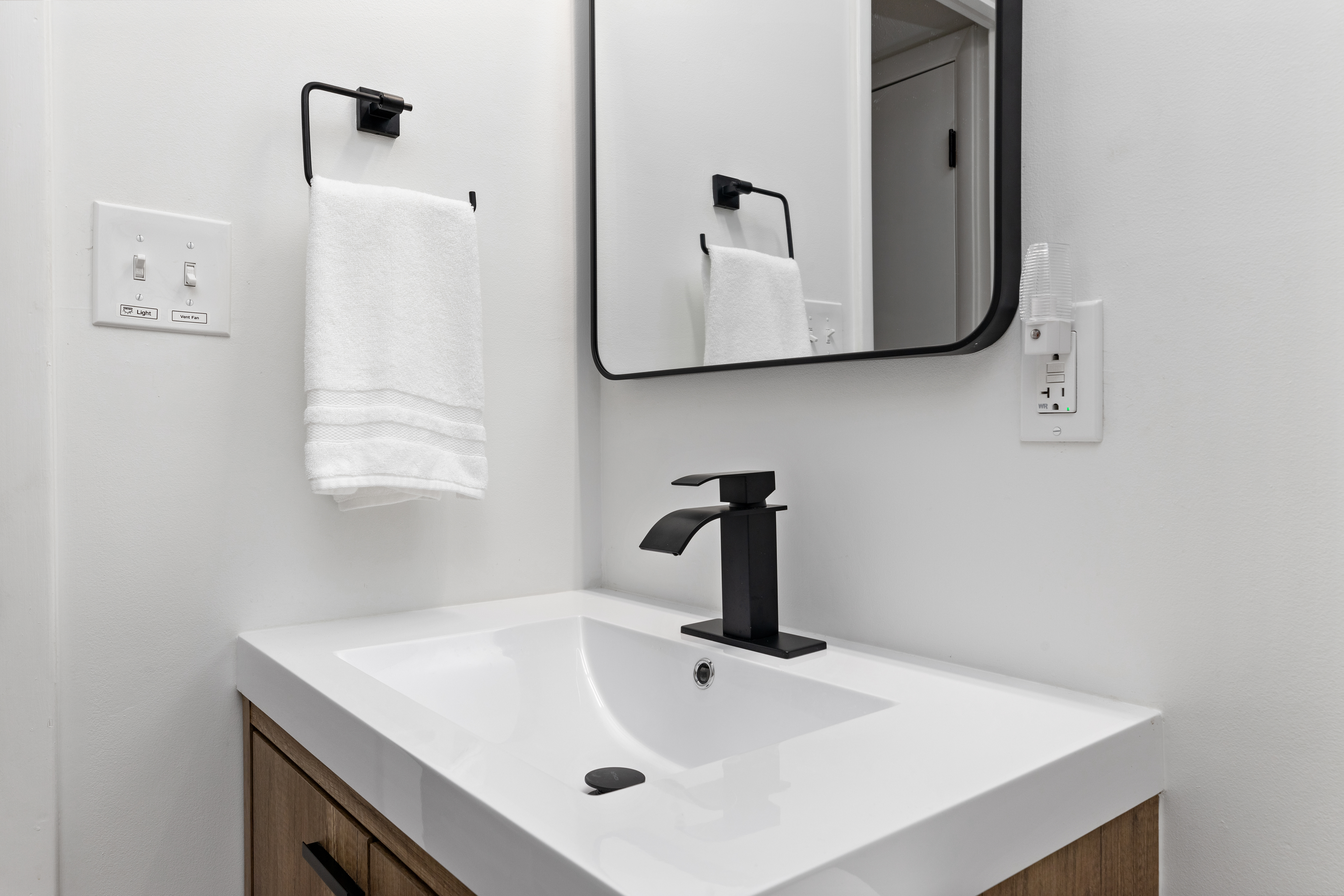 Bathroom sink and mirror at The Retreat at Three Ridges, Wintergreen VA